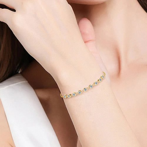 Golden Bracelet with Blue Gemstones
