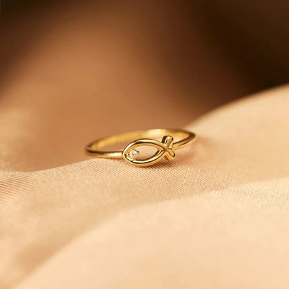 Delicate Gold Fish-Shaped Ring with Tiny Gem - A Whimsical and Elegant Finger Adornment